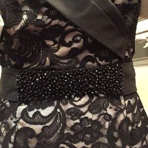 Black lace cap sleeve dress with ivory lining